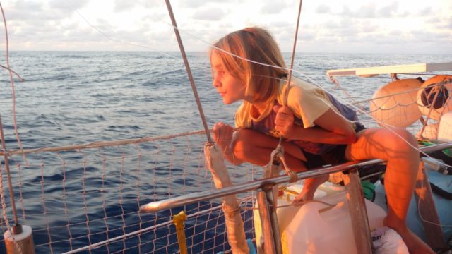Yann, younger and foam of the family, a real pirate at the tender age. <br> Sailboat Kamoka between Tonga and New Caledonia, South Pacific. by Google Translate